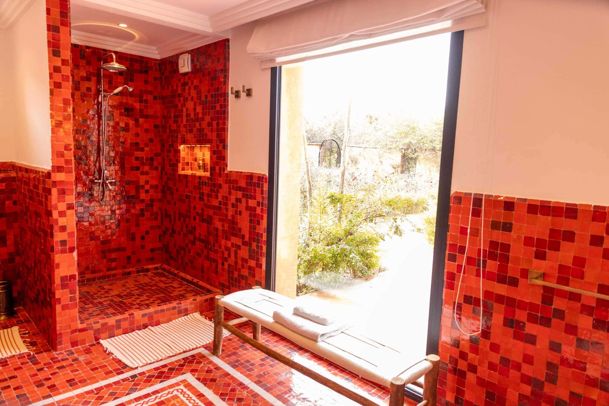 Imlil Suite at Villa Yemna in Marrakech, bathroom with red shower, exterior view.